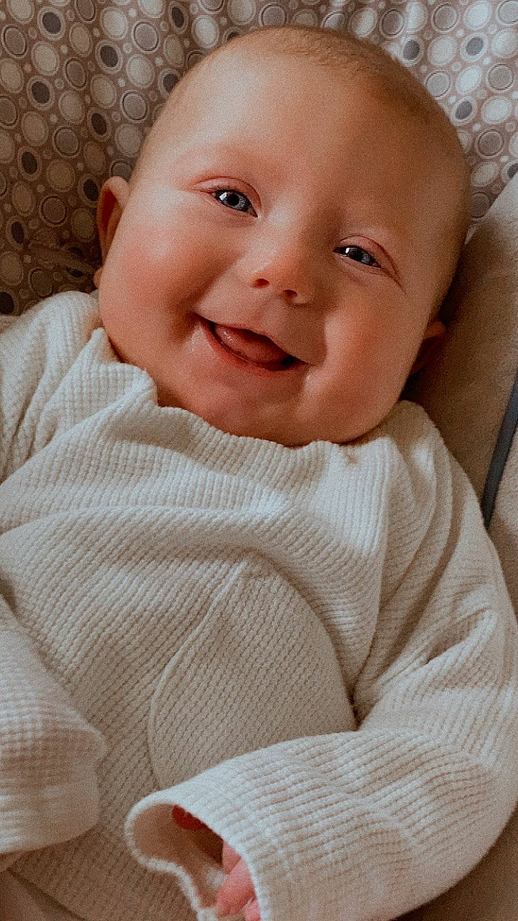 Oaklee is registered to the contest to win money with this photo: baby, baby_laughing, baby_toddler_clothing, cheek, child, collar, comfort, eye, eyebrow, happy, iris, joy, laugh, linens, lip, nose, pattern, person, skin, sleeve