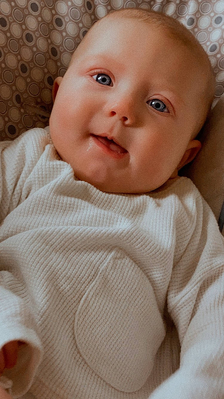 Oaklee joined the competition — help win amazing prizes! baby, baby_toddler_clothing, cheek, child, collar, comfort, eyebrow, eyelash, happy, iris, linens, lip, nose, pattern, person, portrait_photography, sitting, skin, sleeve, smile