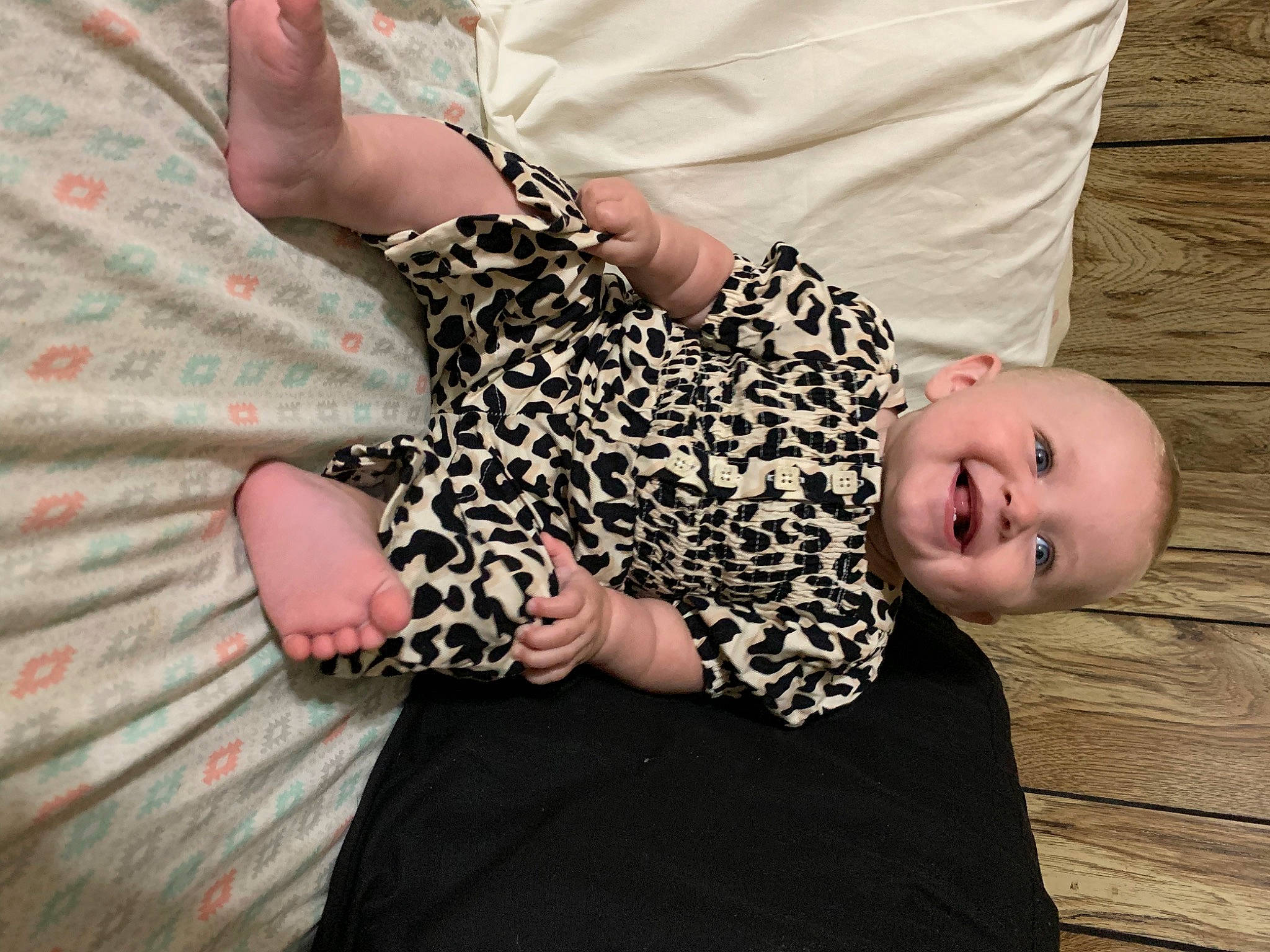Charolette is registered to the contest to win money with this photo: arm, baby, baby_toddler_clothing, comfort, eye, finger, gesture, hair, hand, happy, joy, leg, nail, pattern, person, sleeve, t_shirt, textile, thigh, toddler