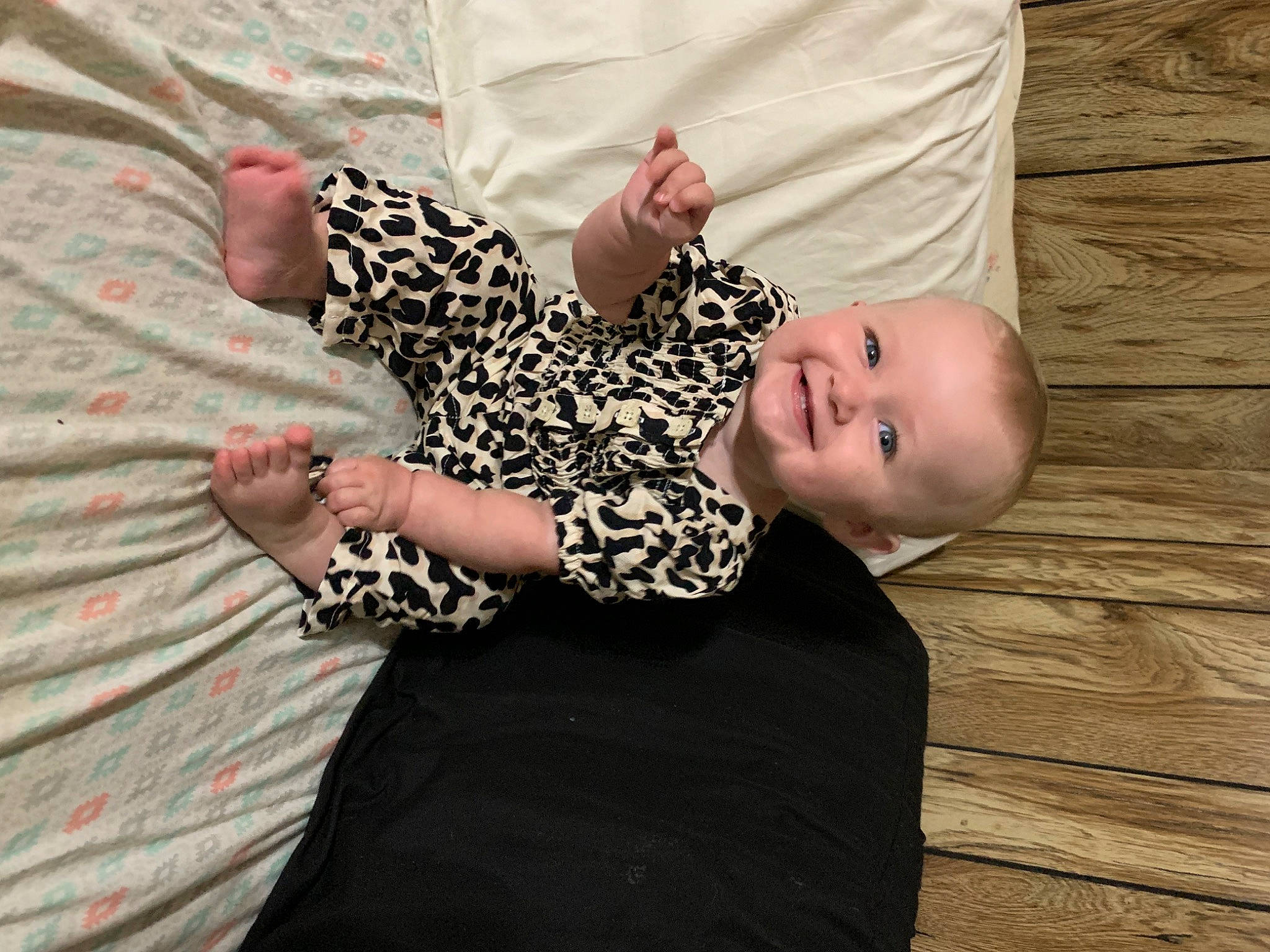Charolette is registered to the contest to win money with this photo: arm, baby, baby_toddler_clothing, comfort, day_dress, dress, eye, finger, flooring, gesture, hand, happy, headgear, human_body, joy, nail, pattern, person, sleeve, smile