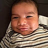 Jazer joined the competition — help win amazing prizes! baby, smile, face, striped_shirt, infant, closeup, child, cushion, happy, portrait, person, young_child, skin, head, eyes, cheeks, mouth, clothing, indoors, baby_fashion