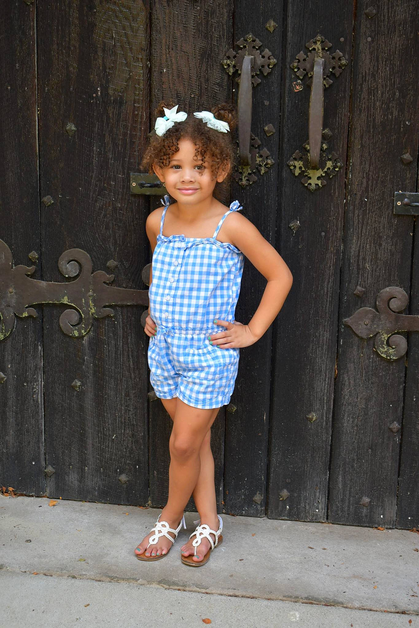 Avyanna is registered to the contest to win money with this photo: baby_toddler_clothing, day_dress, dress, electric_blue, fashion_design, flash_photography, formal_wear, happy, human_leg, joy, knee, magenta, pattern, person, sandal, shoulder, sleeve, smile, thigh, toddler