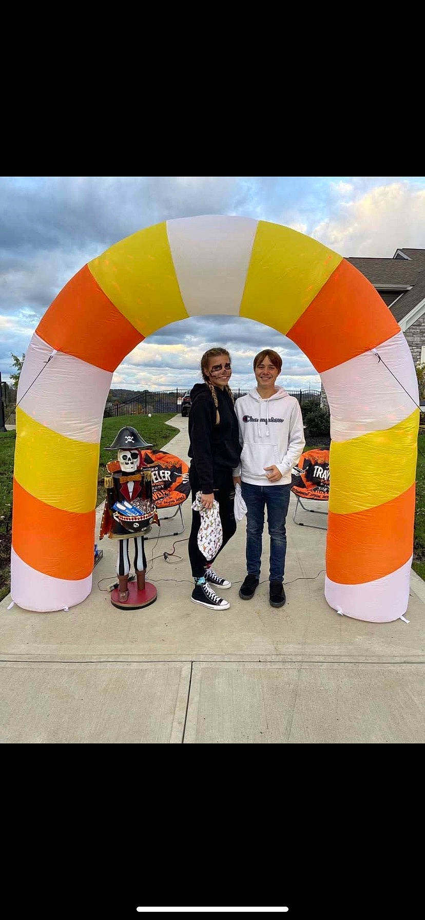 Ethan is registered to the contest to win money with this photo: advertising, arch, championship, cloud, competition, competition_event, event, fun, games, inflatable, joy, leisure, multi_sport_event, outdoor_recreation, person, personal_protective_equipment, recreation, sky, smile, sports