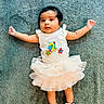 Aira joined the competition — help win amazing prizes! baby, infant, tutu, pink_socks, blue_carpet, star_decorations, number_two, cute, lying_down, arms_outstretched, clothing, portrait, child, indoor, soft_texture, curious_expression, young, funny_outfit, celebration, adorable