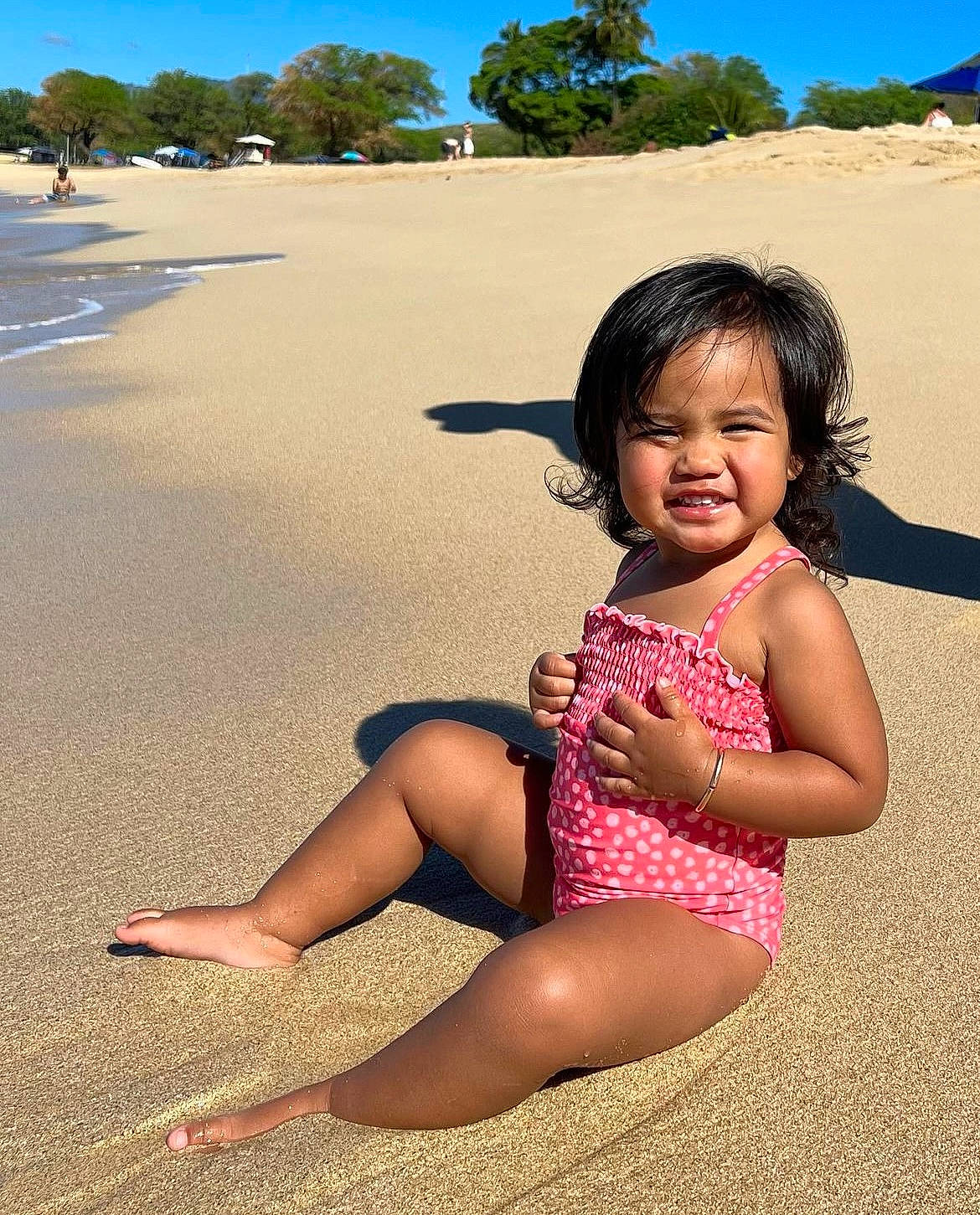 Melanie is registered to the contest to win money with this photo: beach, beauty, child, finger, fun, grass, happy, human_leg, landscape, leg, leisure, natural_environment, people_in_nature, person, skin, sky, summer, thigh, toddler, travel