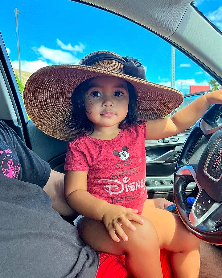 Melanie joined the competition — help win amazing prizes! auto_part, automotive_design, automotive_exterior, automotive_lighting, blue, bumper, car, car_seat, car_seat_cover, cool, hat, headgear, headwear, hood, motor_vehicle, person, personal_luxury_car, steering_wheel, sun_hat, toddler