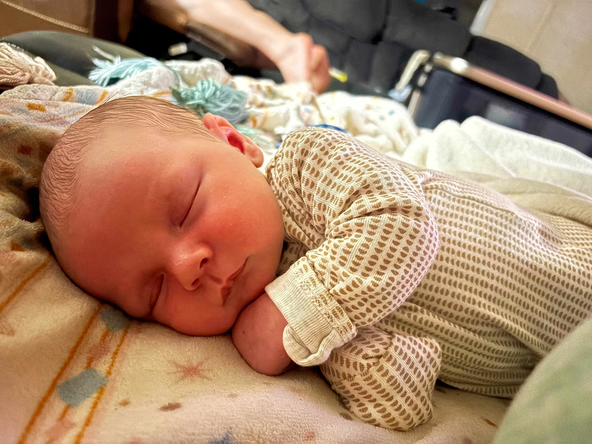 Waylon is registered to the contest to win money with this photo: baby, newborn, sleeping, blanket, onesie, infant, closeup, face, peaceful, resting, soft, cozy, indoors, person, cute, skin, head, hand, portrait, child