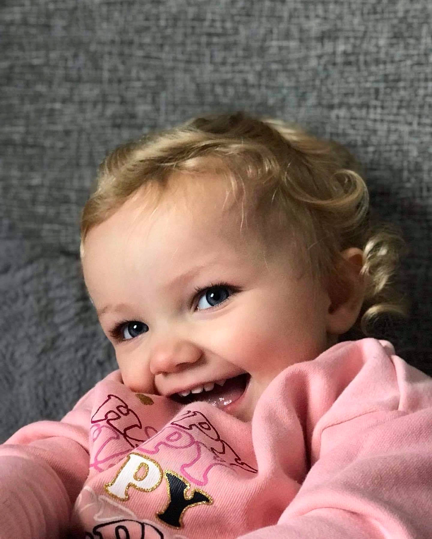 Lilly-rose is registered to the contest to win money with this photo: baby, baby_toddler_clothing, blond, brown_hair, cheek, child, eye, eyebrow, eyelash, finger, forehead, iris, joy, lip, nail, person, pink, portrait_photography, skin, thumb