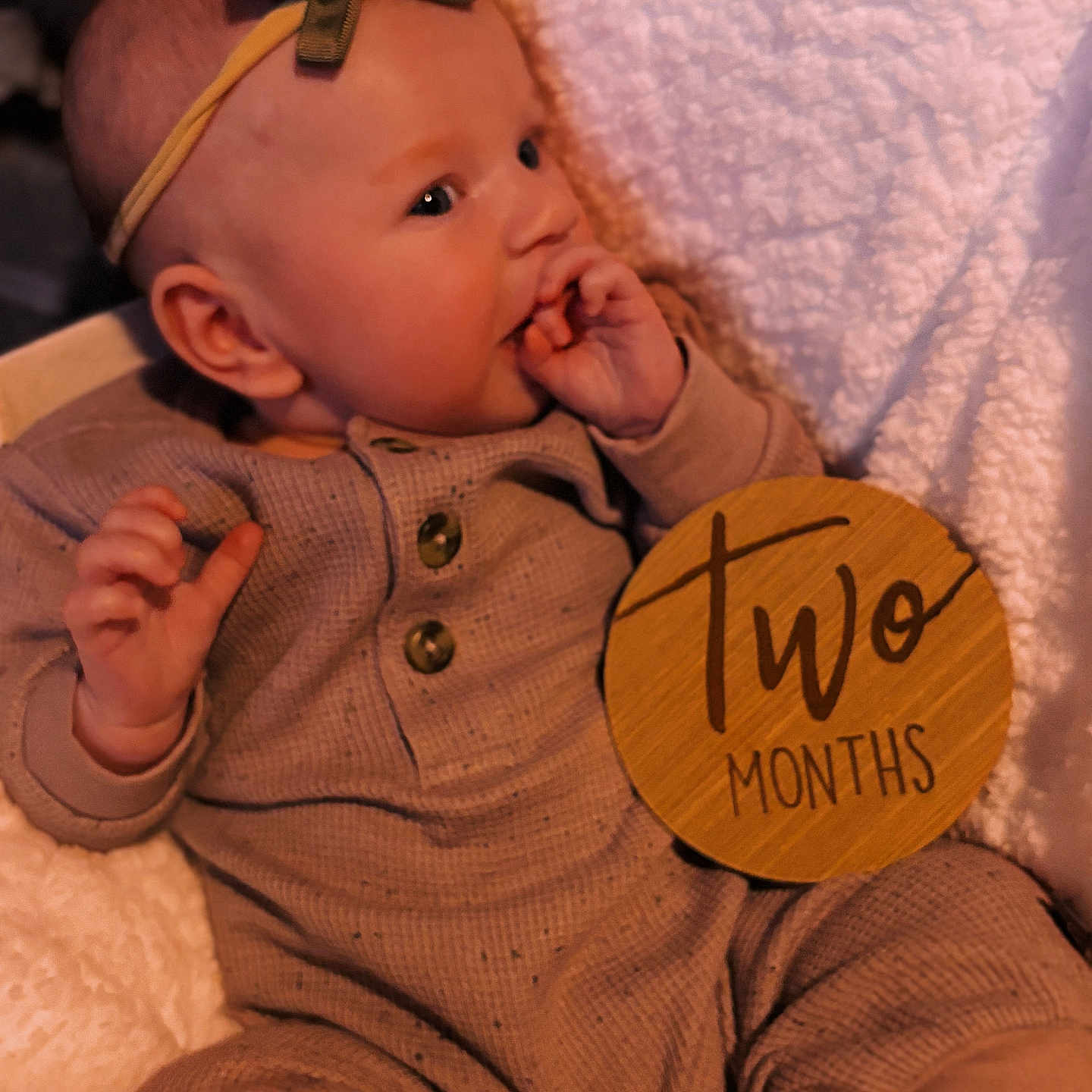Eleanor is registered to the contest to win money with this photo: baby, blanket, bodypart, bonnet, clothing, couch, face, finger, furniture, hand, hat, head, homedecor, knitwear, linen, newborn, person, photography, portrait, sweater