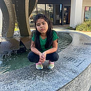 Ana is registered to the contest to win money with this photo: architecture, car, child, clothing, face, female, footwear, fountain, girl, head, pants, person, photography, portrait, shoe, sitting, slate, transportation, vehicle, water