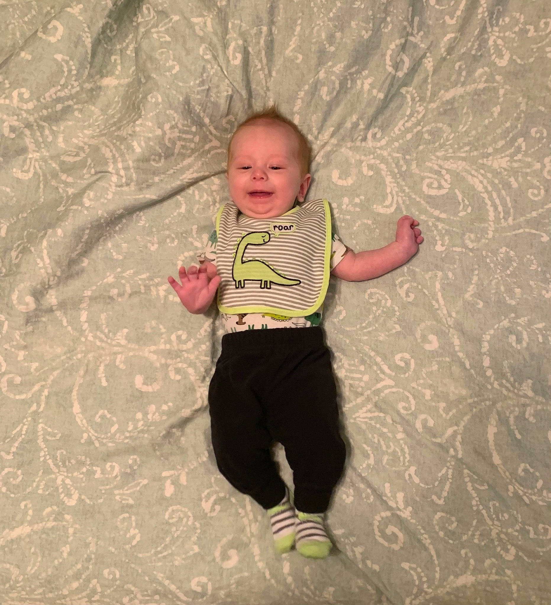 Dalton is registered to the contest to win money with this photo: art, baby, baby_toddler_clothing, child, eye, floor, flooring, fun, gesture, happy, mammal, pattern, person, sleeve, smile, standing, t_shirt, textile, tints_and_shades, toddler