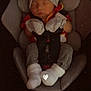 Ronnie is registered to the contest to win money with this photo: baby, sleeping, car_seat, hat, mittens, clothing, infant, child, cute, cozy, safety_harness, footwear, seat, resting, indoors, person, newborn, transportation, soft, wearing