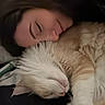 cat, person, sleeping, closeup, indoor, fluffy_cat, pet, resting, cozy, bed, brush, animal, relaxation, companion, cute, face, fur, head, human, calm