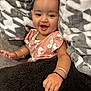 Vedaa is registered to the contest to win money with this photo: baby, child, smiling, blanket, pink_clothing, bunny_prints, bracelet, hand, cozy, soft_texture, happy, portrait, indoor, cute, infant, couch, warm, fuzzy, person, young