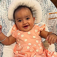 Vedaa joined the competition — help win amazing prizes! baby, child, smiling, happy, infant, peach_dress, daisy_pattern, bracelet, baby_chair, cushion, comfort, indoors, portrait, cute, small_hands, happy_face, seated, head_support, soft_fabric, joyful