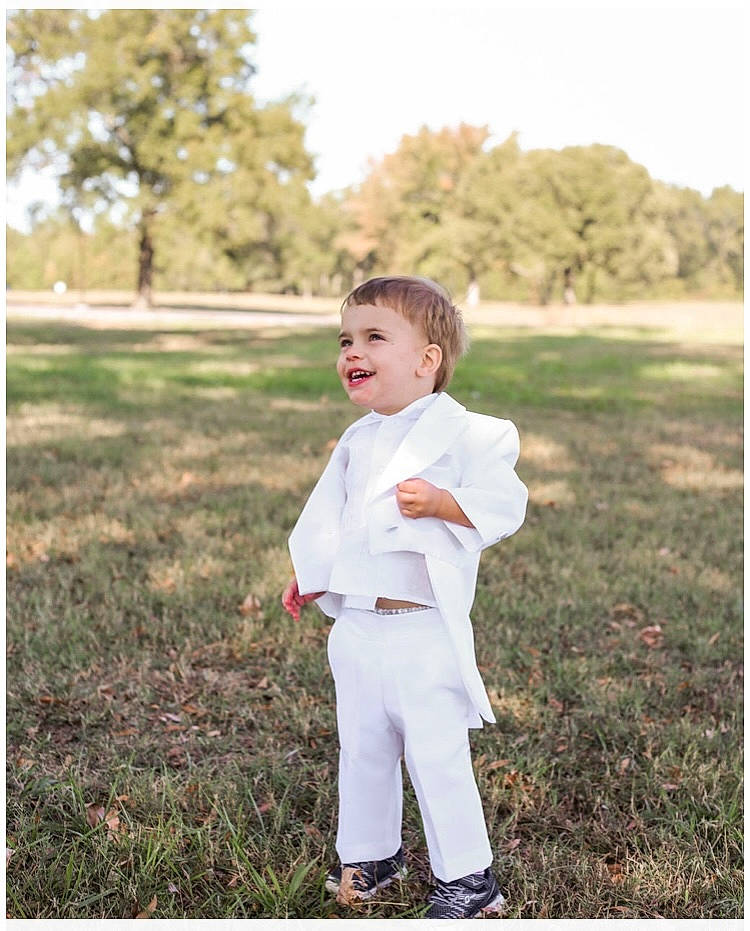 Braylon joined the competition — help win amazing prizes! flash_photography, formal_wear, fun, gesture, grass, grassland, happy, joy, lawn, meadow, people_in_nature, person, plant, portrait, portrait_photography, prairie, sky, sleeve, soil, toddler