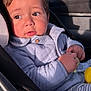 Santiago joined the competition — help win amazing prizes! toddler, child, car_seat, toy, jacket, quilted_jacket, striped_pants, baby, seatbelt, car_interior, sunlight, brown_eyes, curly_hair, cute, portrait, indoors, casual_clothing, seat, infant, hands