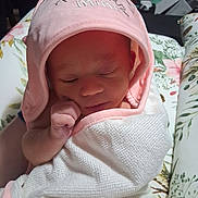Chika is registered to the contest to win money with this photo: newborn, baby, blanket, pink_hood, sleeping, face, hand, cushion, floral_pattern, soft_lighting, indoors, wrapped, peaceful, cute, child, portrait, infant, resting, fabric, cozy