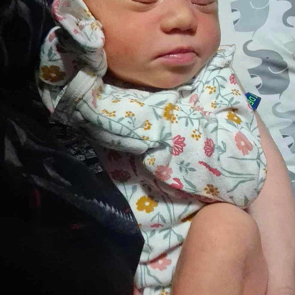 Chika is registered to the contest to win money with this photo: arm, baby, closeup, clothing, cute, elephant_pattern, floral_pattern, hand, indoors, infant, newborn, onesie, peaceful, person, pillow, rest, skin, sleeping, soft, toddler