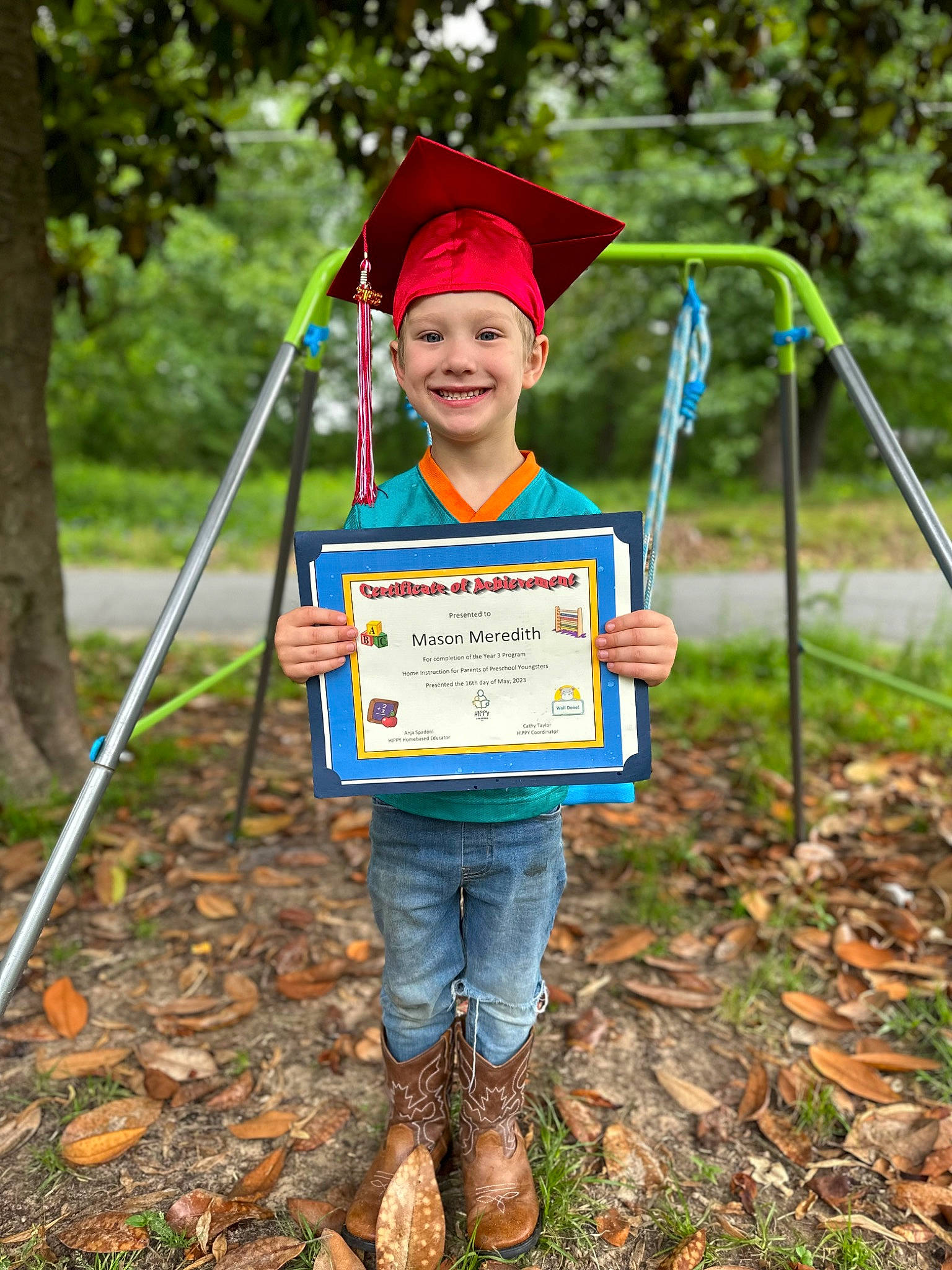 Mason is registered to the contest to win money with this photo: child, electric_blue, event, eye, face, fun, grass, happy, hat, headwear, joy, leisure, mortarboard, person, plant, public_space, recreation, smile, soil, t_shirt