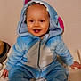toddler, child, smiling, costume, blue, shark, hood, teeth, sitting, bed, striped_socks, indoor, cute, happy, plush, clothing, person, face, baby, cozy