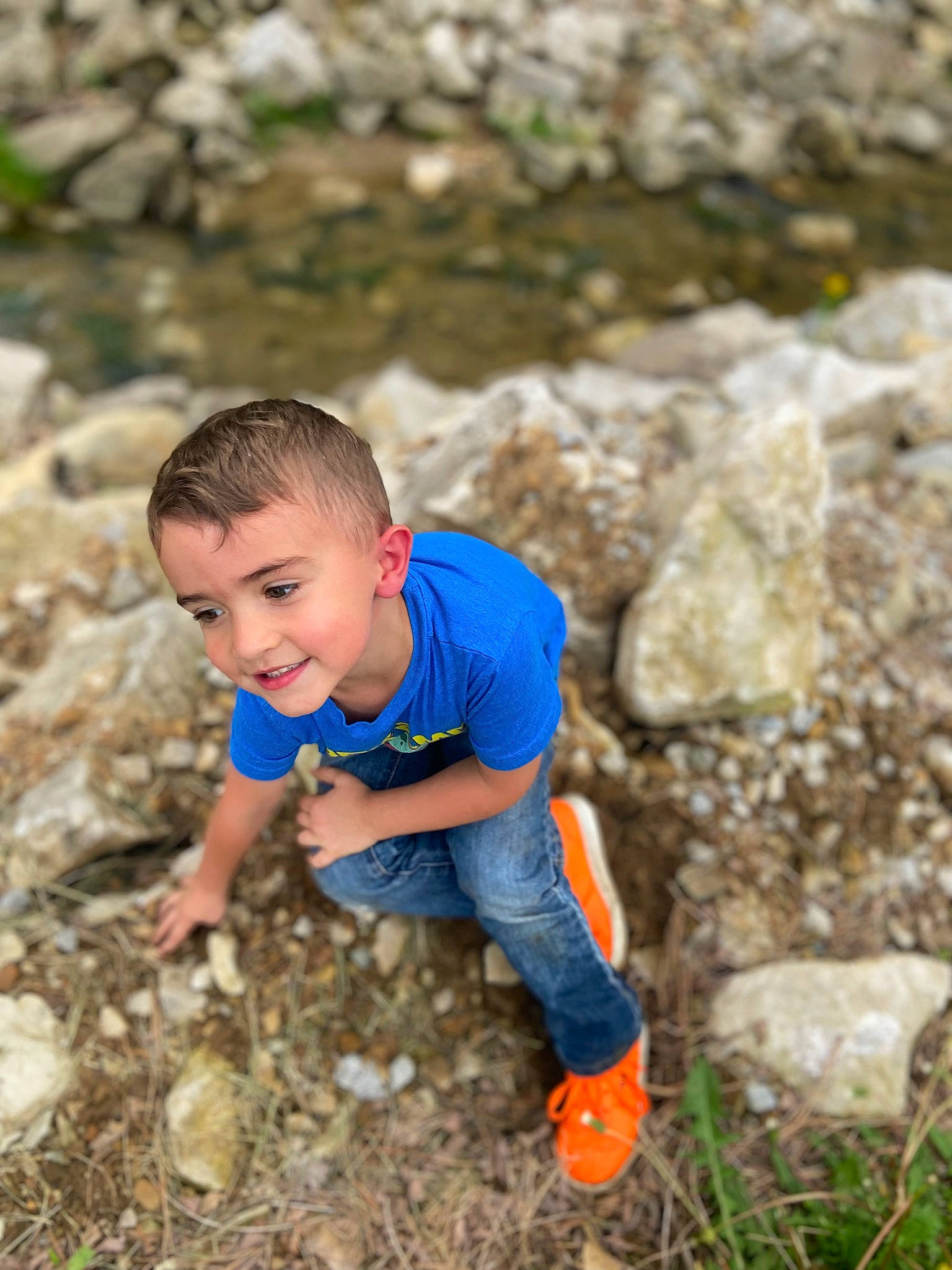 Talon Hiller joined the competition — help win amazing prizes! adventure, bedrock, electric_blue, eye, fun, grass, happy, joy, landscape, leisure, people_in_nature, person, plant, recreation, rock, sitting, smile, soil, t_shirt, toddler
