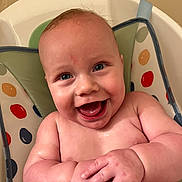 Isaiah joined the competition — help win amazing prizes! baby, baby_seat, bouncer, child, close_up, colorful, eyes, face, hands, happy, indoor, infant, joyful, laughing, photography, polka_dot, portrait, sitting, skin, smiling