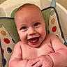 baby, baby_seat, bouncer, child, close_up, colorful, eyes, face, hands, happy, indoor, infant, joyful, laughing, photography, polka_dot, portrait, sitting, skin, smiling