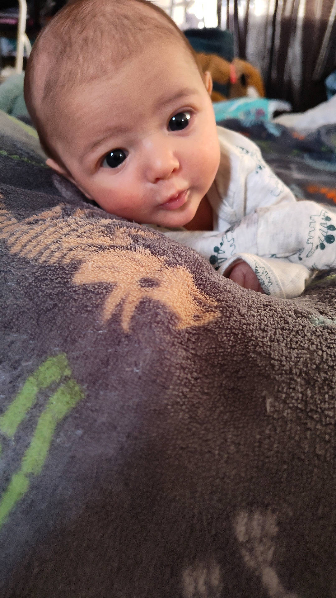 baby, blanket, bodypart, couch, crawling, face, finger, furniture, hand, happy, head, homedecor, linen, newborn, person, photography, portrait, quilt, smile, towel