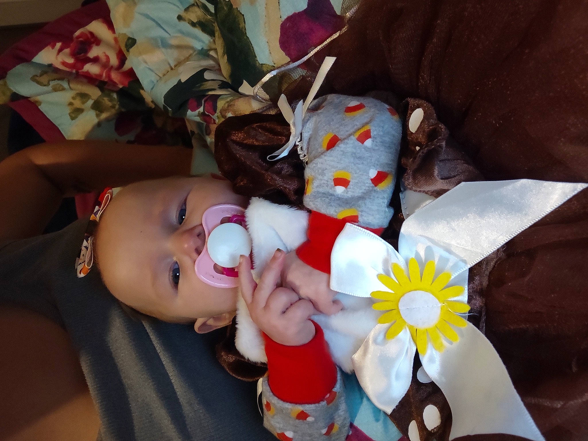 Kathleen is registered to the contest to win money with this photo: baby, baby_products, baby_sleeping, baby_toddler_clothing, baby_toys, carmine, cheek, child, comfort, doll, headgear, lap, linens, nail, person, plush, product, sitting, stuffed_toy, toddler