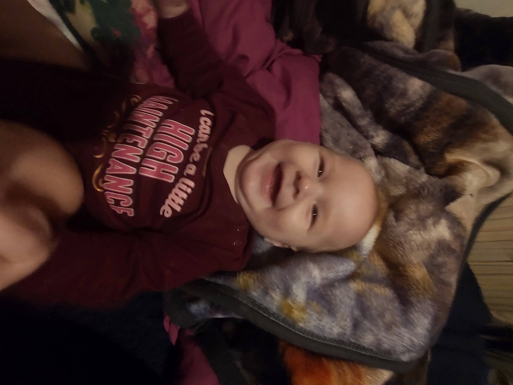 Kathleen is registered to the contest to win money with this photo: baby, carmine, cheek, child, comfort, darkness, flash_photography, flesh, font, fun, fur, happy, joy, lip, mouth, person, room, sleeve, smile, toddler