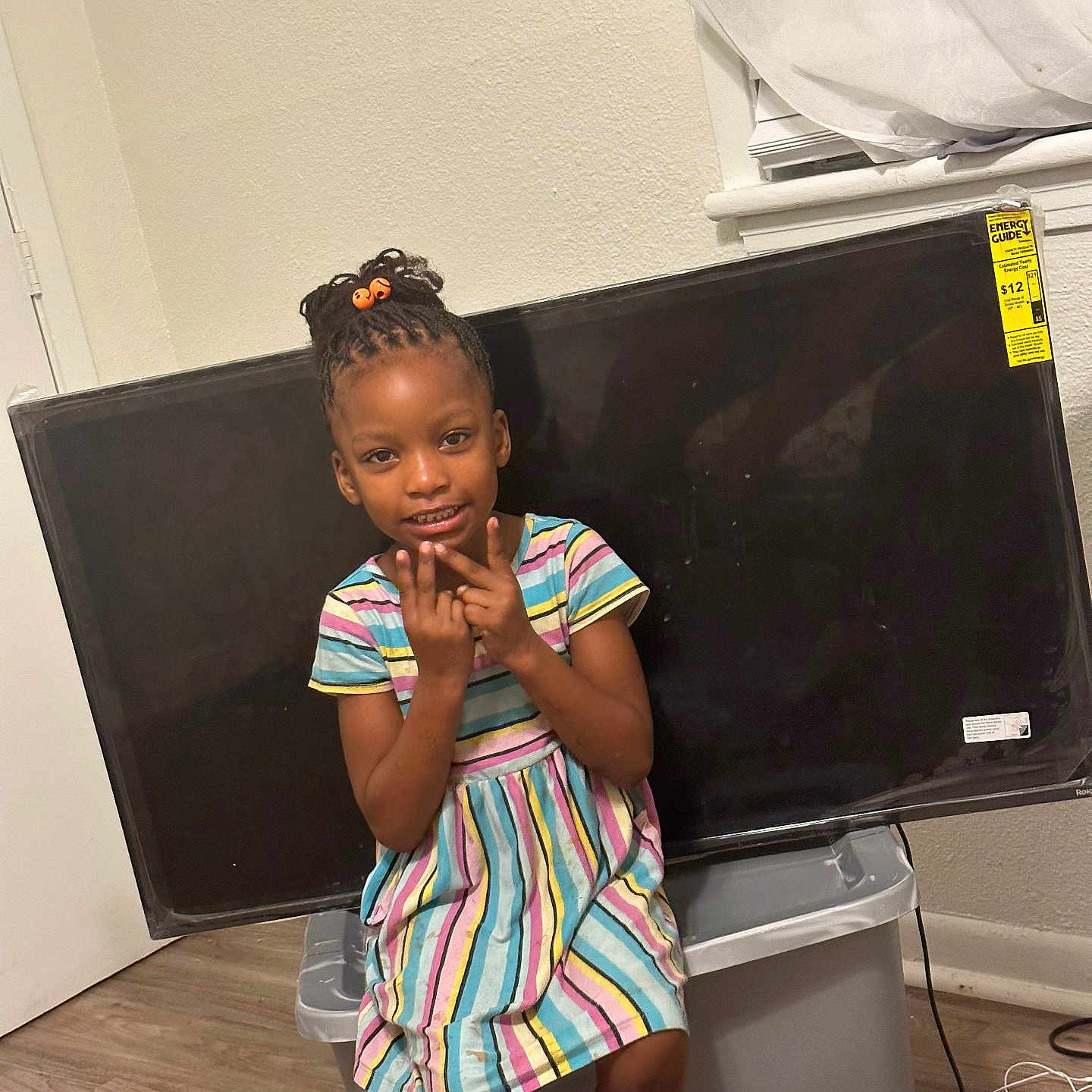 Andrea is registered to the contest to win money with this photo: child, clothing, computerhardware, electronics, face, female, furniture, girl, happy, hardware, head, monitor, person, photography, portrait, screen, sitting, sleeve, smile, table