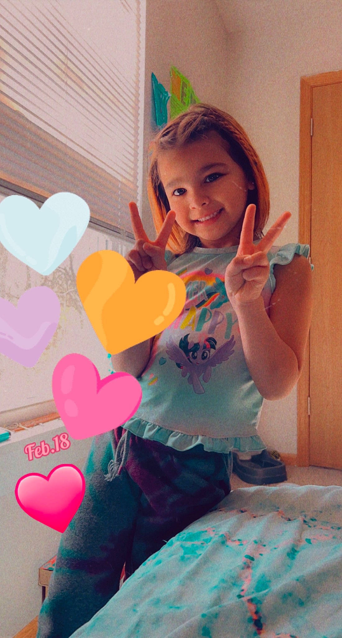 Melody is registered to the contest to win money with this photo: arm, baby_toddler_clothing, balloon, child, event, facial_expression, finger, fun, gesture, hairstyle, happy, human_body, human_leg, joy, leg, party_supply, person, pink, smile, t_shirt