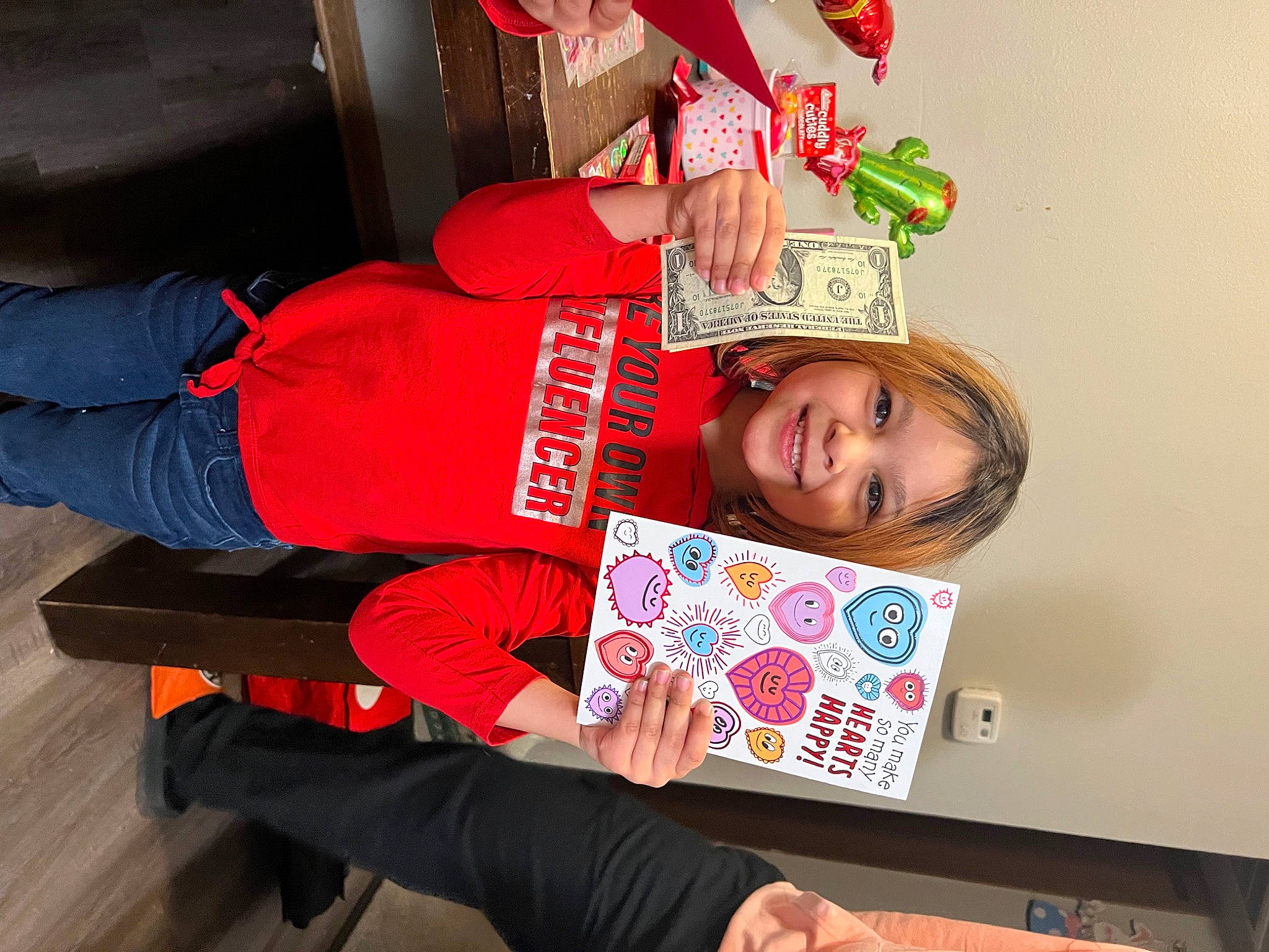 Melody is registered to the contest to win money with this photo: carmine, child, comfort, event, fun, happy, holiday, joy, knee, lap, person, room, sleeve, smile, t_shirt, toddler