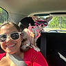 Novina joined the competition — help win amazing prizes! car_interior, casual, companion, dog, greenery, happy, pet, pink_goggles, pink_harness, road, road_trip, seatbelt, shoulder, smile, sunglasses, sunlight, travel, trees, window, woman