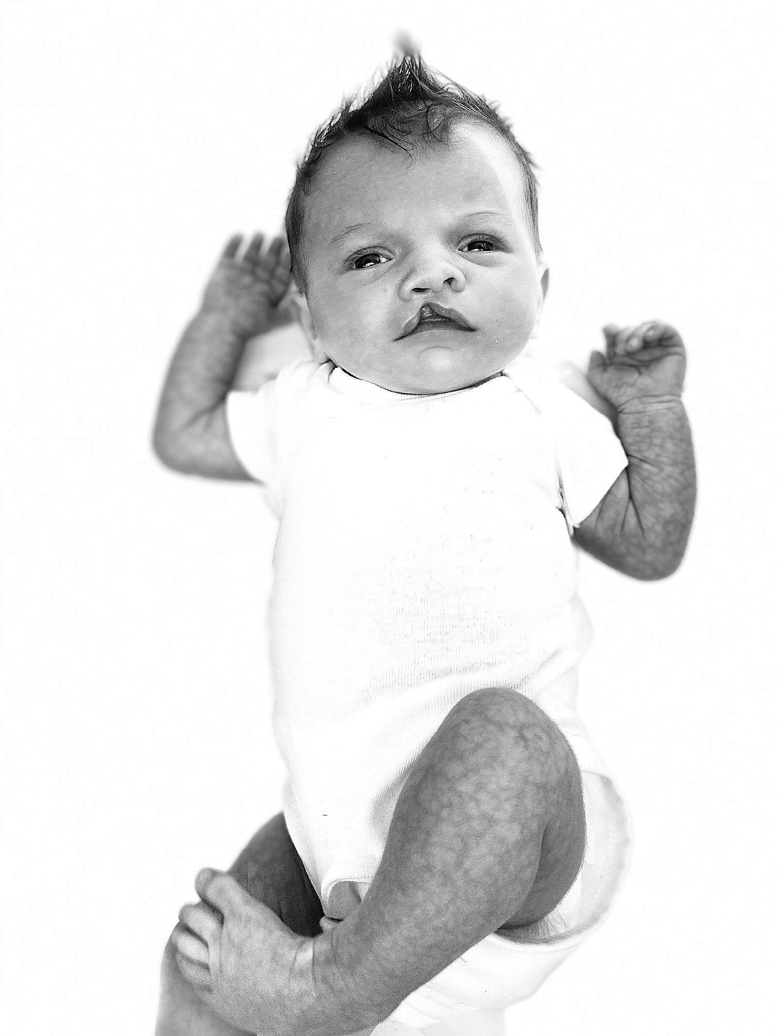 Alison is registered to the contest to win money with this photo: arm, baby, black, black_and_white, cheek, child, eye, face, facial_expression, head, monochrome, monochrome_photography, nose, person, photograph, photography, portrait, smile, standing, toddler