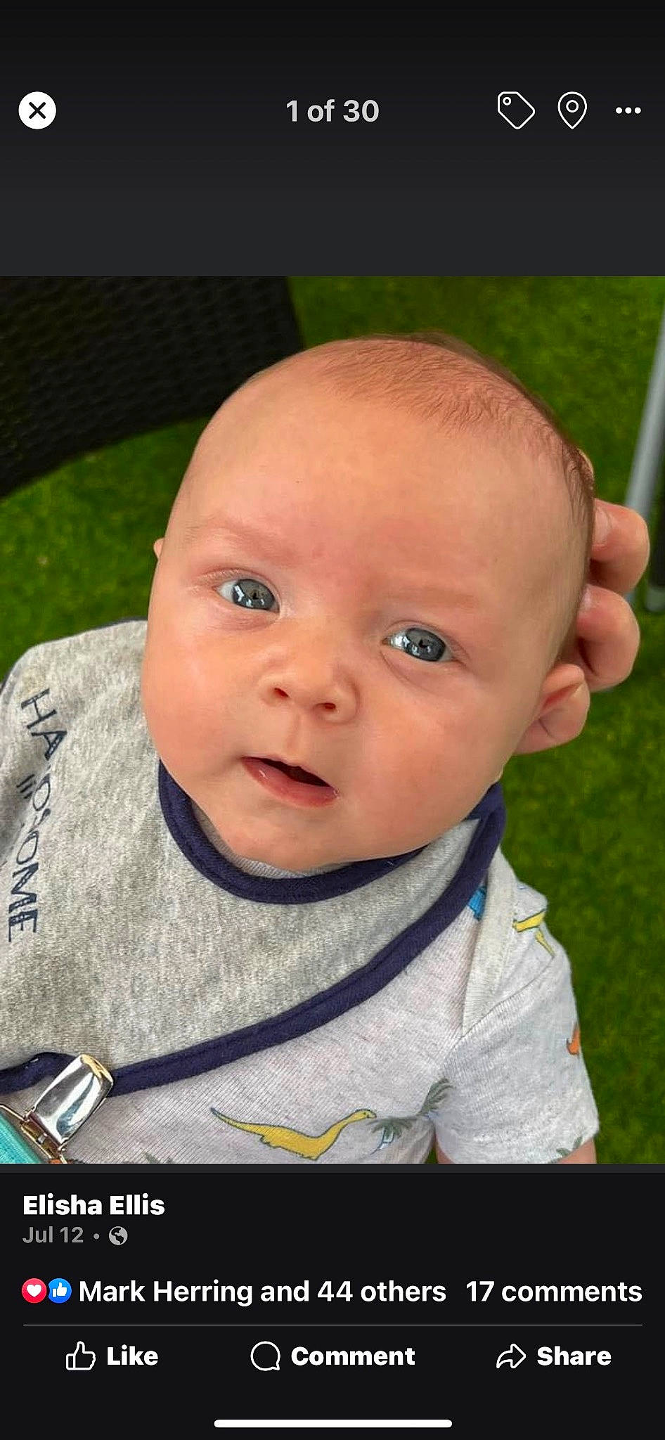 Dylen is registered to the contest to win money with this photo: baby, baby_products, baby_toddler_clothing, cheek, child, eyelash, fun, gesture, grass, happy, nose, people_in_nature, person, portrait_photography, sitting, skin, sleeve, smile, thumb, toddler