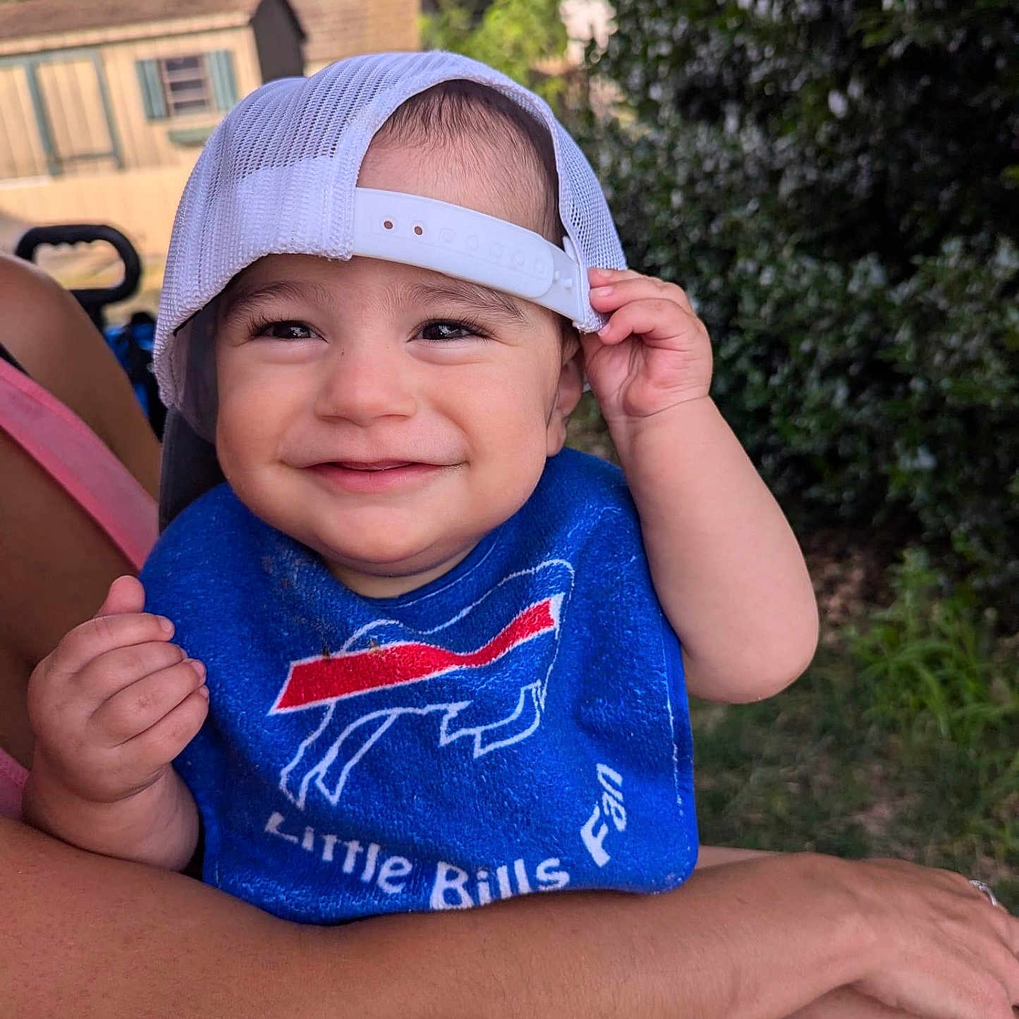 Louis is registered to the contest to win money with this photo: baby, baseballcap, bodypart, cap, city, clothing, face, finger, grass, hand, happy, hat, head, person, photography, plant, portrait, smile, swimwear, t_shirt