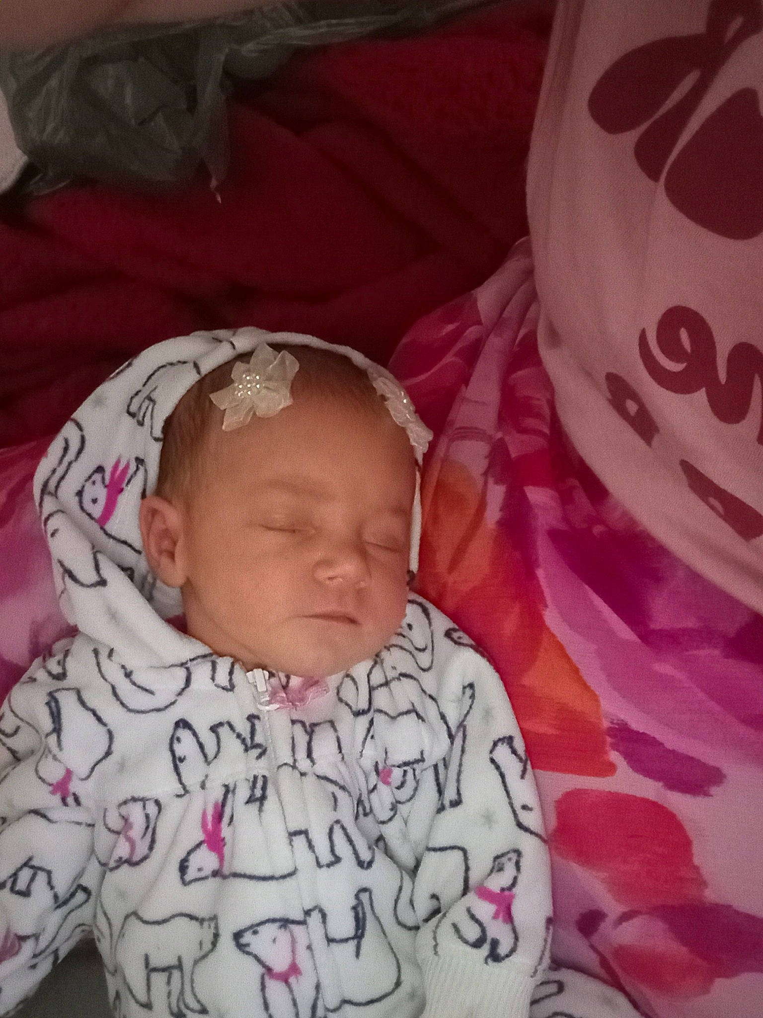 Cheryl is registered to the contest to win money with this photo: baby, baby_sleeping, baby_toddler_clothing, cheek, comfort, eye, eyebrow, face, happy, head, linens, lip, mouth, nose, pattern, person, pink, skin, sleeve, textile