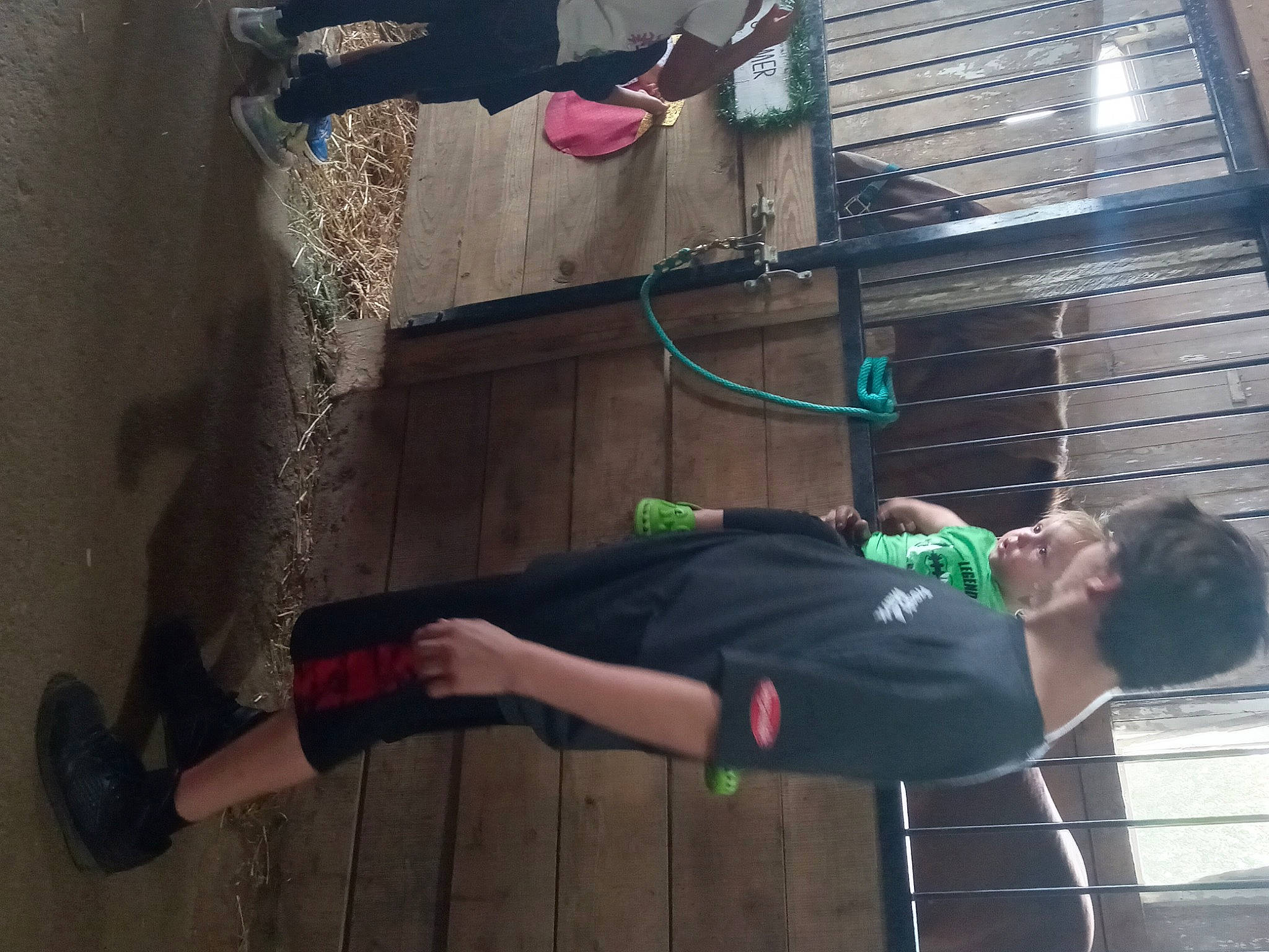 Christopher is registered to the contest to win money with this photo: adventure, balance, child, elbow, foot, fun, human_leg, joint, knee, leg, leisure, magenta, person, physical_fitness, recreation, room, sandal, shorts, sportswear, t_shirt