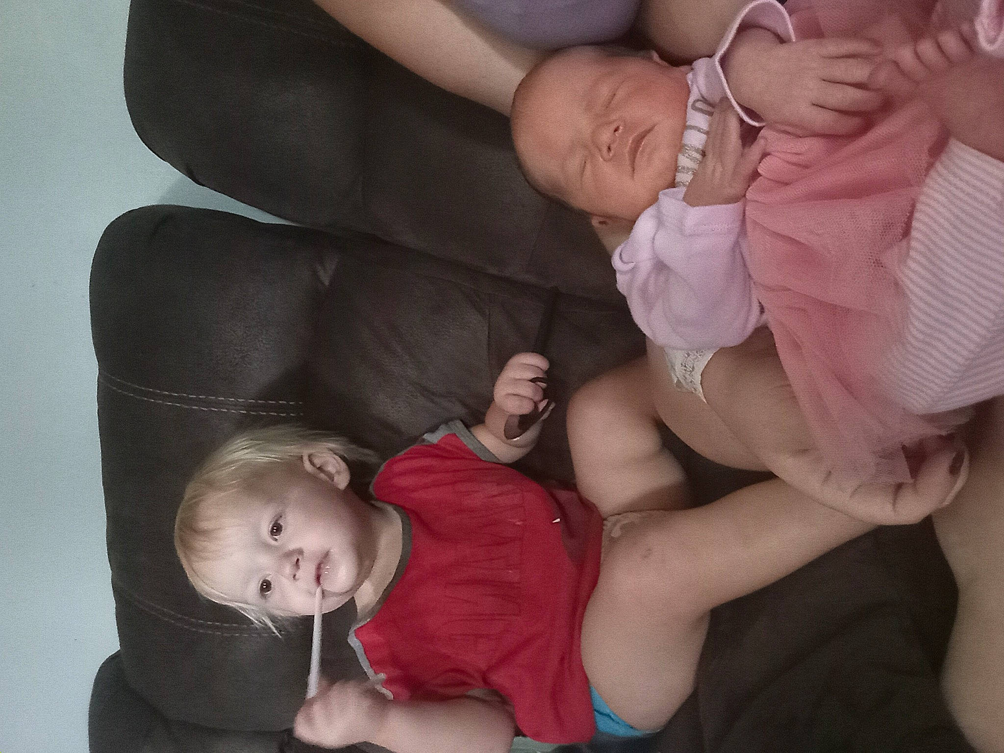 Christopher is registered to the contest to win money with this photo: arm, baby, baby_toddler_clothing, cheek, comfort, face, facial_expression, finger, flash_photography, gesture, hand, human_body, interaction, leg, mouth, muscle, organ, person, pink, product