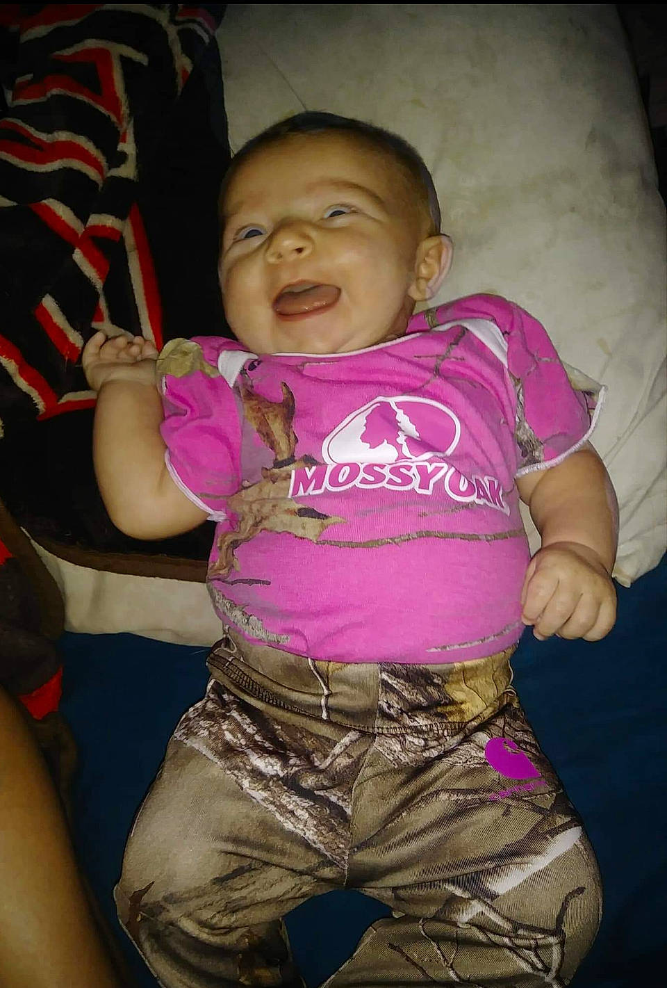 Alyson is registered to the contest to win money with this photo: abdomen, arm, cheek, child, emotion, eye, face, facial_expression, fun, girl, head, mouth, person, pink, purple, sitting, skin, smile, toddler, trunk