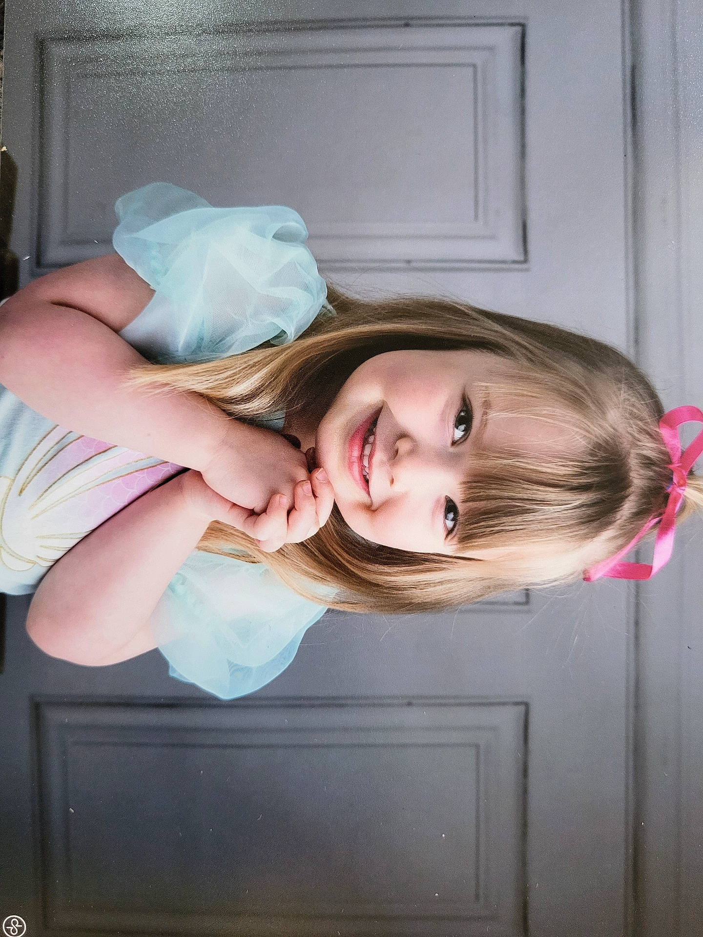 Hallie is registered to the contest to win money with this photo: blonde, child, clothing, costume, diaper, door, dress, eveningdress, face, female, formalwear, girl, hair, happy, head, person, photography, portrait, purple, smile