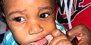 Dayton is registered to the contest to win money with this photo: adult, baby, candid, child, closeup, clothing, curly_hair, expression, face, fingers, hand, holding, hoodie, indoor, nike, person, portrait, skin, toddler, young