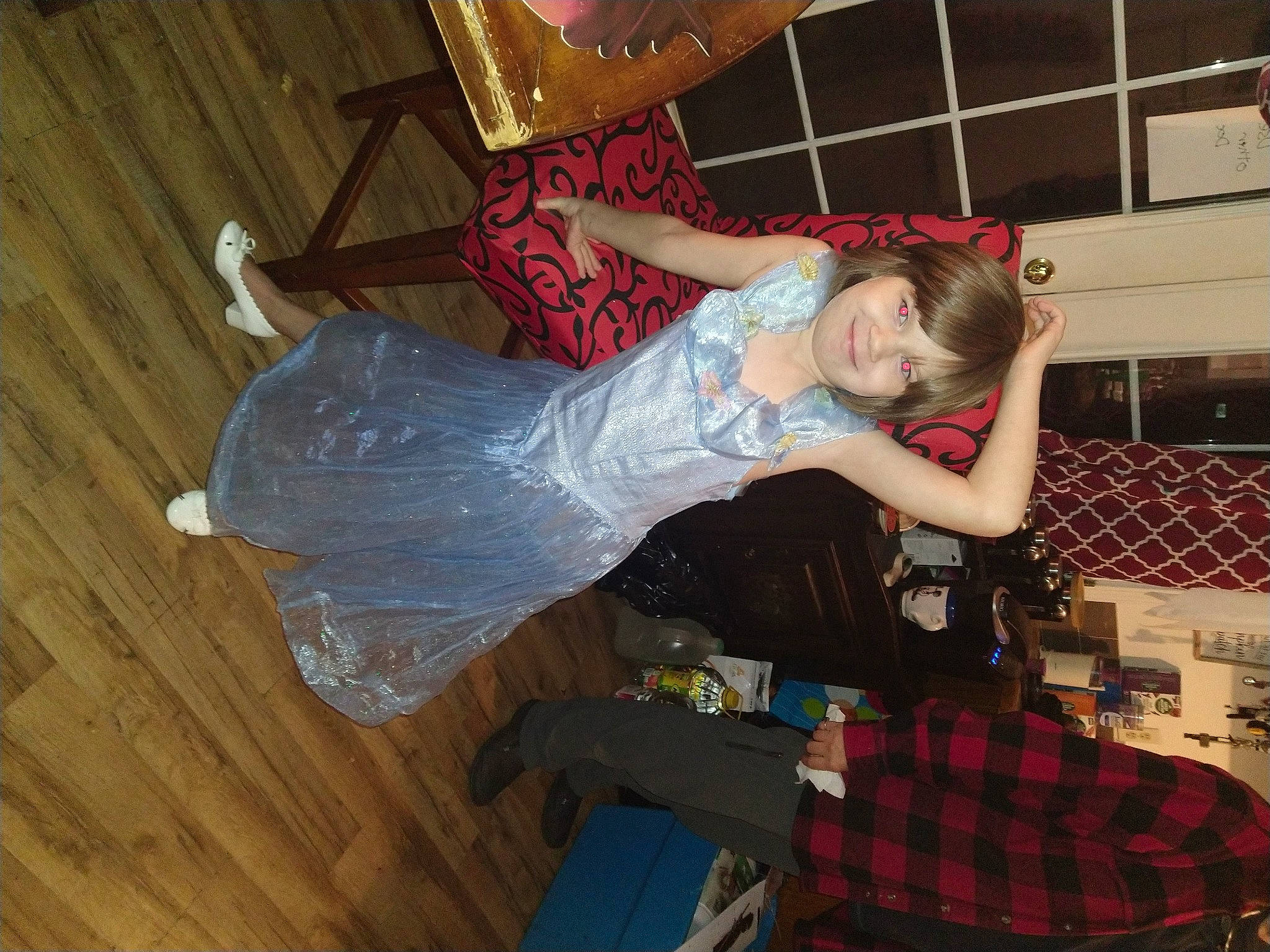 Isabelle is registered to the contest to win money with this photo: bridal_accessory, costume, dress, event, fashion_design, flash_photography, flesh, flooring, fun, hardwood, haute_couture, human_leg, joy, pattern, person, plaid, smile, tartan, wood