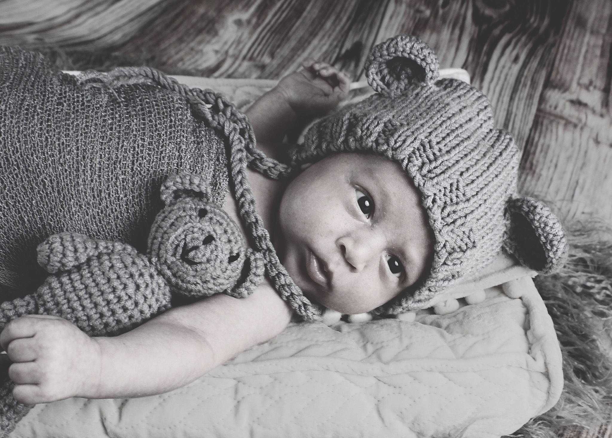 Ayden is registered to the contest to win money with this photo: baby, child, close_up, comfort, flash_photography, fur, grass, grey, happy, headgear, headwear, iris, monochrome, monochrome_photography, person, sitting, skin, stock_photography, textile, toddler