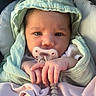 baby, infant, pacifier, clothing, blanket, hand, face, headwear, cute, newborn, soft_light, wrapped, child, portrait, indoors, expression, skin, fingers, comfort, seat