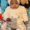 Truly joined the competition — help win amazing prizes! baby, bed, blanket, child, cozy, cute, expression, face, floral_clothing, hands, headband, indoors, infant, monkey_toy, person, plush_toy, portrait, sitting, sleepwear, soft_toys