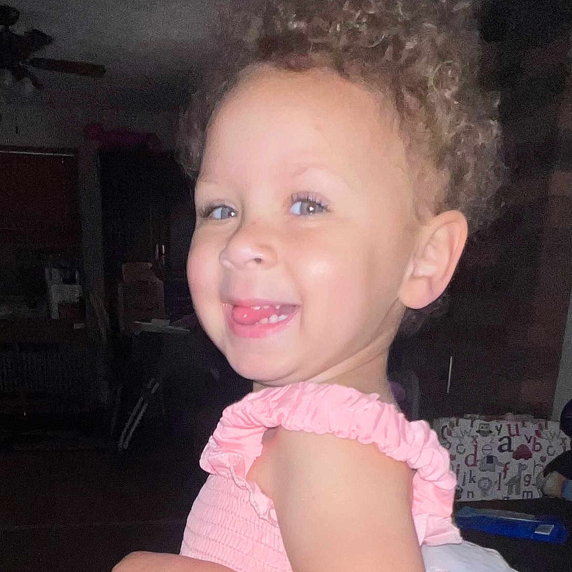 Luna is registered to the contest to win money with this photo: baby, blonde, bodypart, clothing, cosmetics, couch, dress, face, furniture, hair, happy, head, indoors, laughing, mouth, person, photography, portrait, smile, teeth