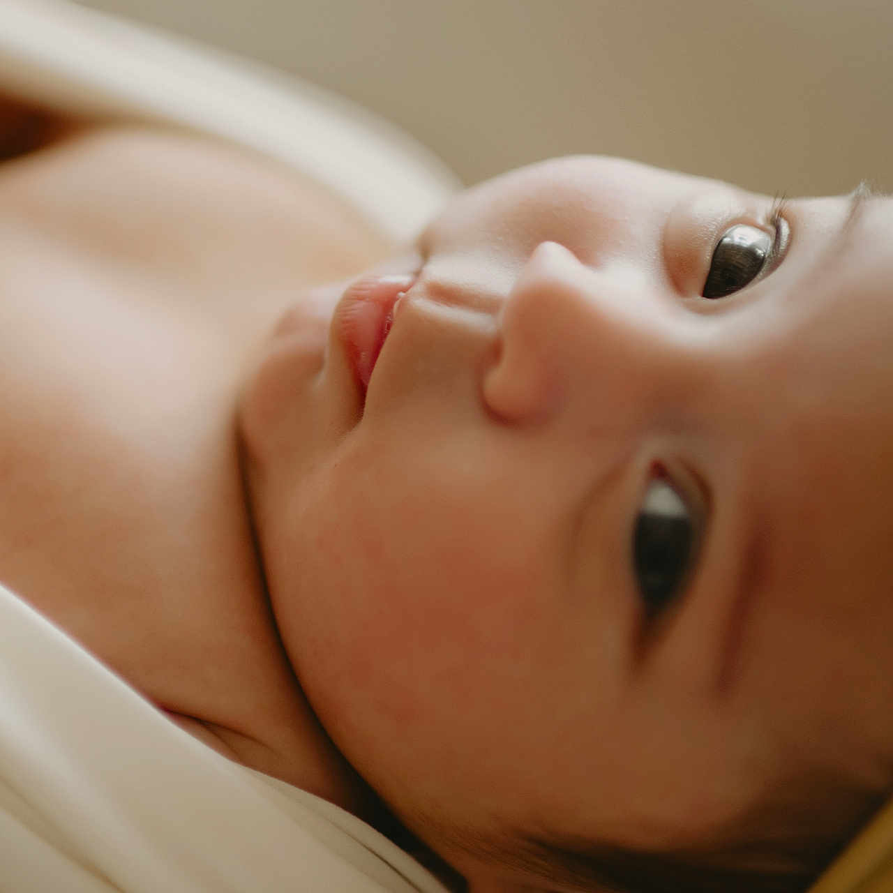 Dani is registered to the contest to win money with this photo: baby, bodypart, bonnet, cap, clothing, face, finger, hand, hat, head, mouth, newborn, person, photography, portrait